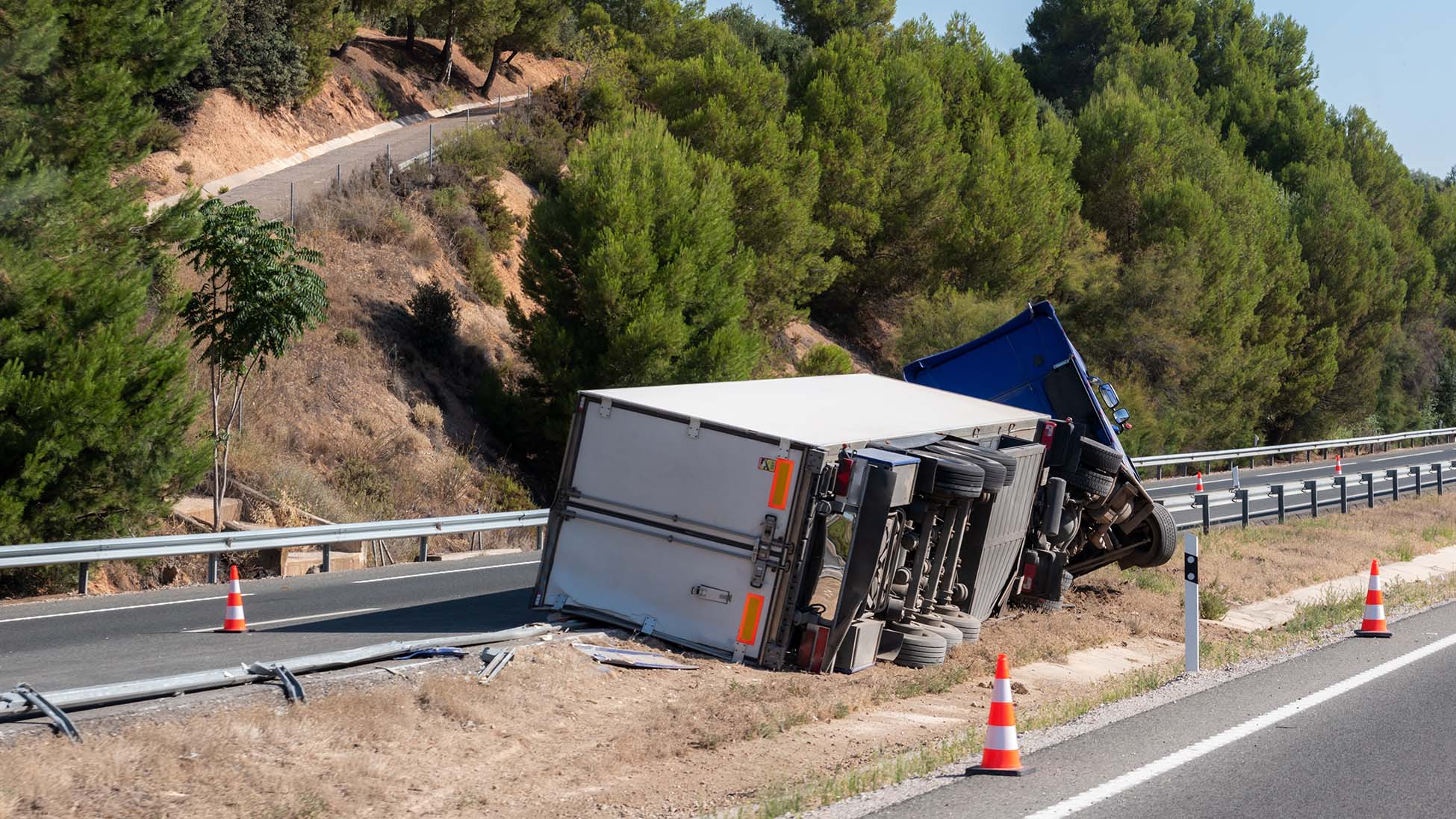 Semi truck turned over on the road